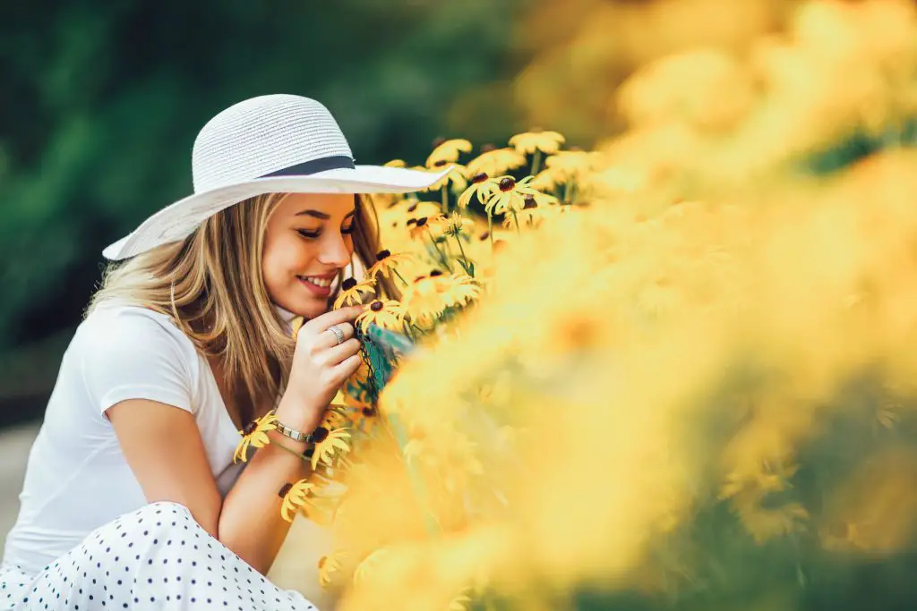 girl smelling flowers