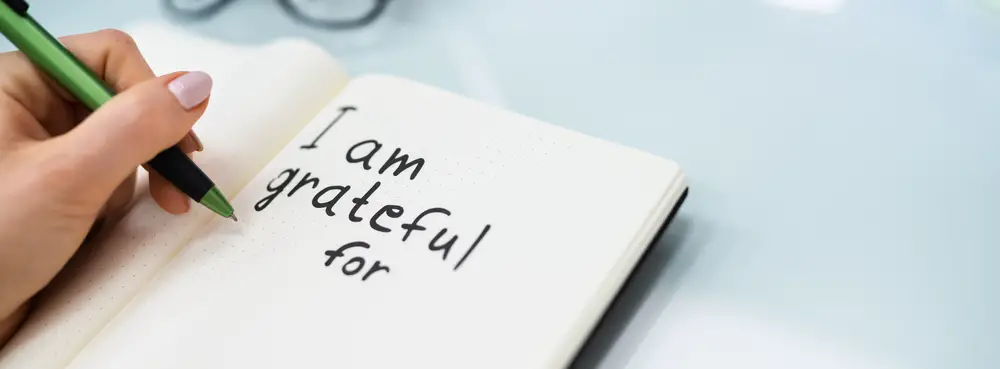 Gratitude Journal Concept. Writing I Am Grateful In Journal